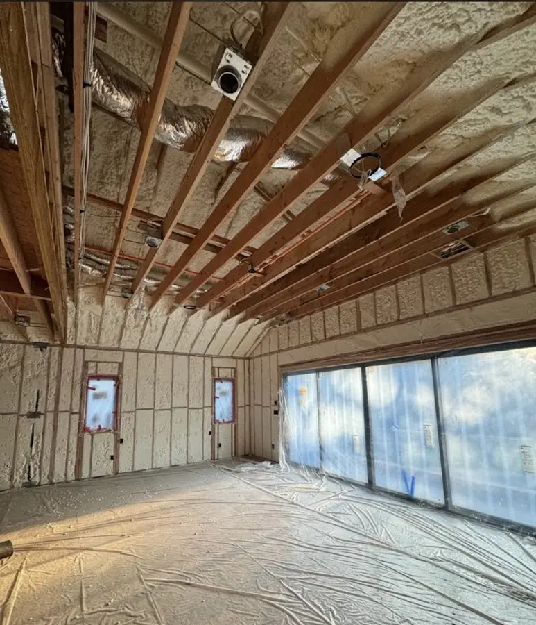 Interior walls and ceiling insulated with spray foam during new construction in Holland